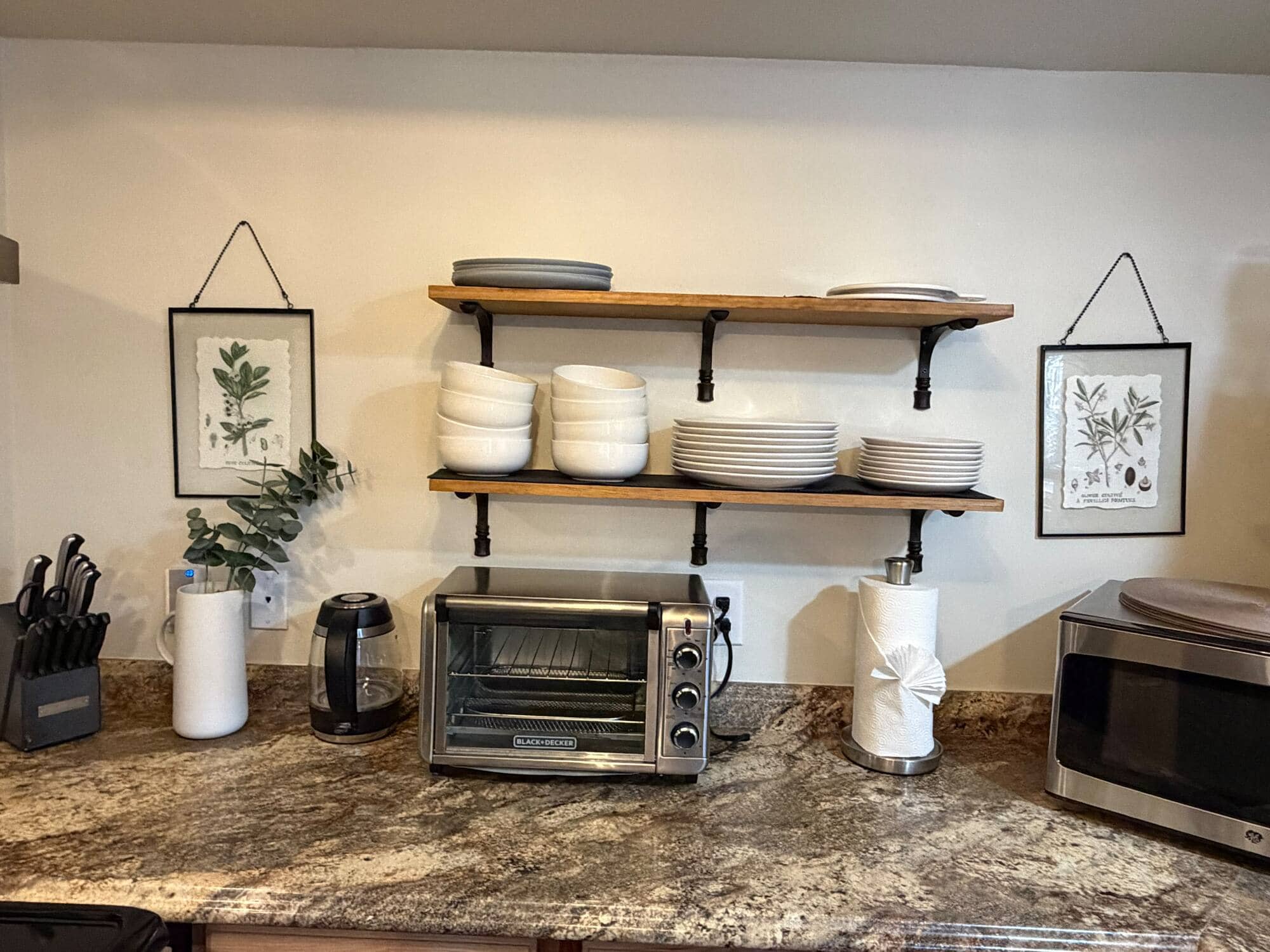 A kitchen left spotless after a move-out clean — counters wiped and shelving tidied